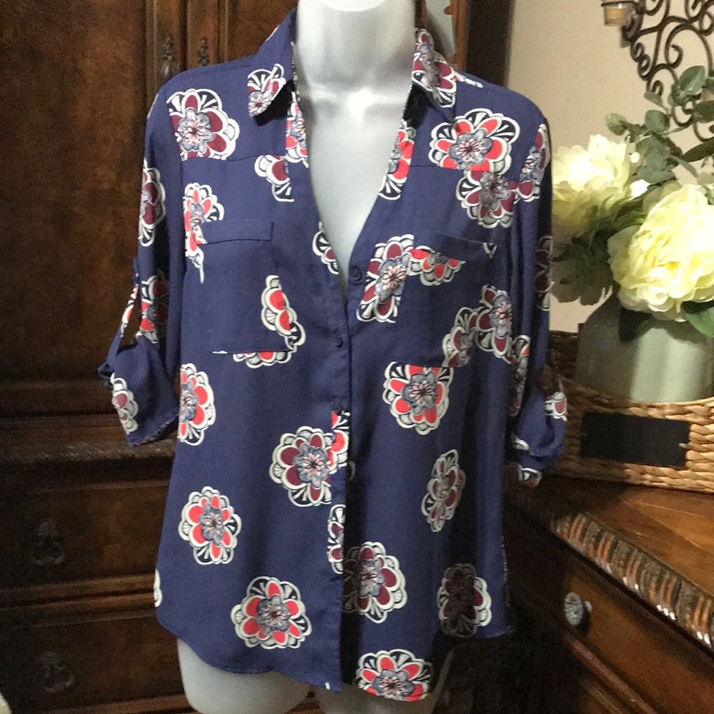Brighten your wardrobe with this charming floral blouse from Express